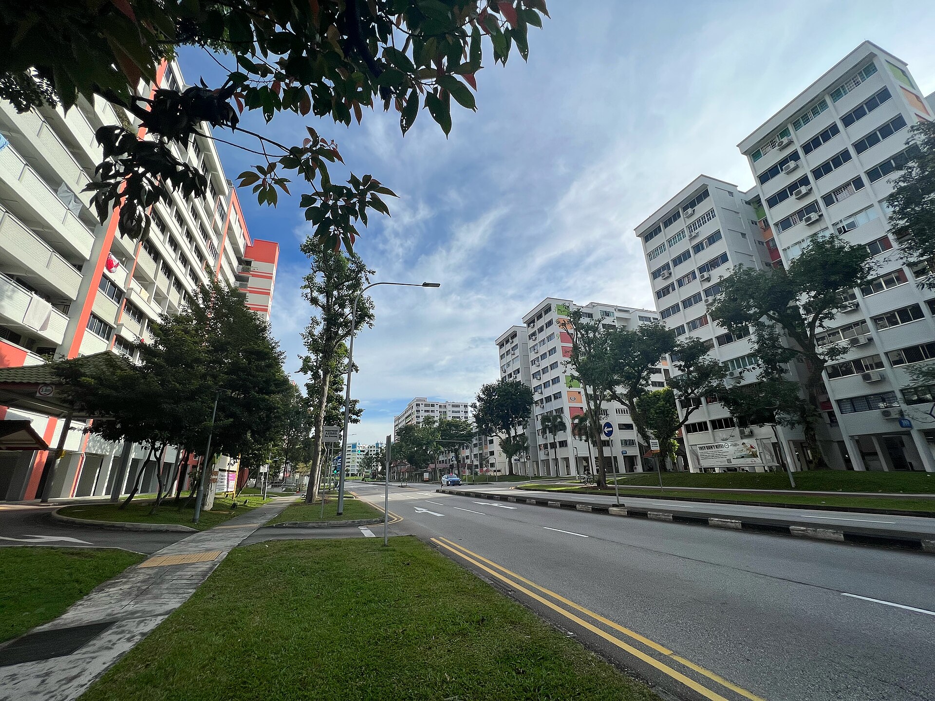 Three HDB blocks — 359, 360 and 398 — standing in a row along Yishun Ring Road under a bright sky.